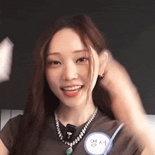 a woman wearing a name tag that says ' eun ' on it