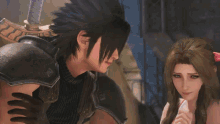 a man and a woman are standing next to each other .