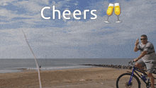 a man riding a tandem bike on the beach with the words cheers above him