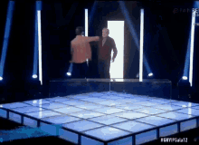 two men are standing on a stage with the hashtag ghvipgala12
