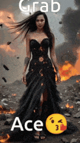 a woman in a long black dress is standing in front of a fire and says grab ace