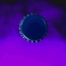a blue bottle cap with a white rectangle on it is on a purple background .