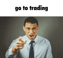 a man in a tie is pointing at the camera with the words go to trading behind him
