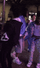 a group of young men are standing in a line and one of them is wearing a shirt that says " яа "