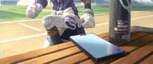 a cartoon character is sitting on a wooden table next to a bottle and a cellphone