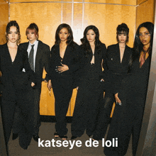 a group of women standing next to each other with katseye de loli on the bottom right