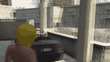 a person in a yellow hoodie is standing next to a black car with a license plate that says ' a '