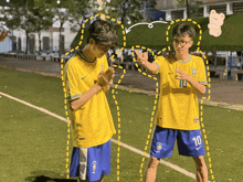 a boy wearing a yellow shirt with the number 10 on the front