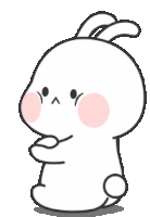 a cartoon rabbit with a pink cheek is standing on its hind legs and looking at the camera .