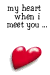 a red heart is flying in the air with the words `` my heart when i met '' written on it .