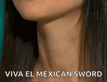a close up of a woman 's neck with the words viva el mexican sword above it .