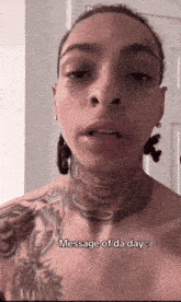 a man with a tattoo on his neck is talking about a message of the day