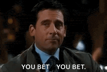 a man in a suit and tie is holding a glass of water and saying `` you bet you bet . ''