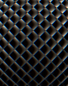 a black background with a pattern of squares that looks like a quilt