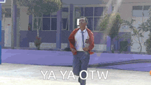a man running in front of a building with the words ya ya otw written on the bottom