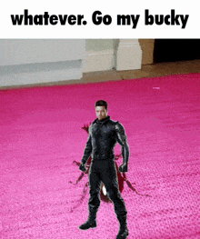 a man in a black suit is standing on a pink carpet with the words " whatever go my bucky "