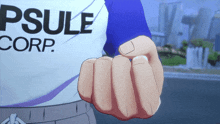 a person wearing a shirt that says psule corp.