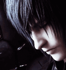 a close up of a person 's face with a black background