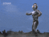 a man is flying through the air with the words ultraman official on the bottom right