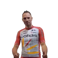a man wearing a red and white cofidis jersey giving two thumbs up