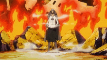 a man in a cape stands in front of a fire