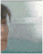 a blurry picture of a woman 's face with a blue wall in the background