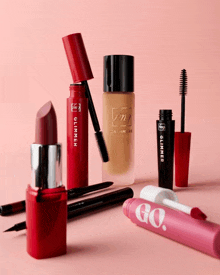a group of makeup products including lipstick mascara and eyeliner