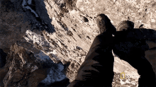 Climbing Down Anthony Mackie Descends A Cliff Face GIF - Climbing Down Anthony Mackie Descends A Cliff Face Going Down GIFs