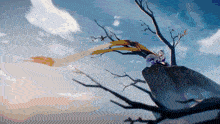 a person sitting on top of a rock with a tree behind them