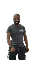 a man with a beard is wearing a gray shirt that says ' glusjesmak ' on the front
