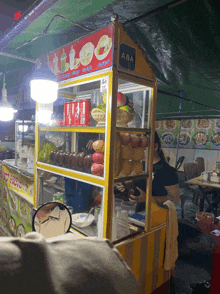 a fruit stand with aba written on the side