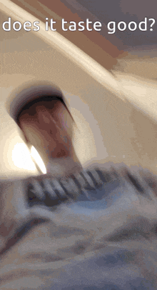 a blurred image of a person with the words " does it taste good " on the bottom