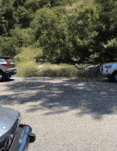 two cars are parked on the side of the road