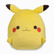 a close up of a yellow stuffed animal with a brown tail and ears on a white background .