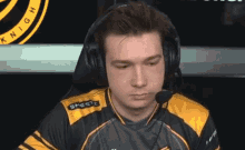 a man wearing headphones and a shirt that says knight