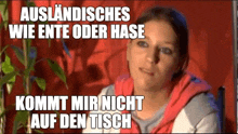 a woman is sitting in front of a plant with a caption that says " auslandisches wie ente oder hase " .