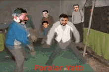 a painting of a group of men with the words paralar yatti in red