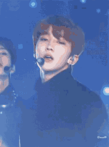 a close up of a person wearing a microphone with the words cloud9 on the bottom right