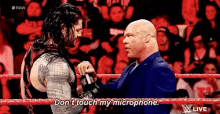 Roman Reigns Dont Touch My Microphone GIF - Roman Reigns Dont Touch My Microphone Kurt Angle GIFs