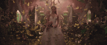 a bride in a wedding dress is surrounded by confetti