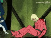 a man in a pink suit is laying on the floor with chinese writing on the bottom right
