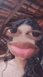 a close up of a woman 's face with glasses and a pink lip