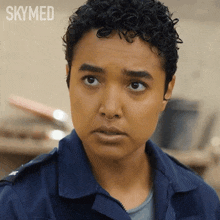 a close up of a woman 's face with the word skymed on the bottom
