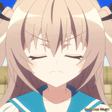 a close up of a girl 's face with an anime project logo in the bottom right corner