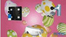 a renpho product is surrounded by colorful eggs