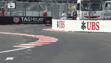a race track with a sign that says tag heuer on it