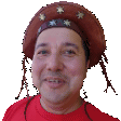 a man wearing a cowboy hat and a red shirt
