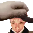 a pixel art of a man wearing a hat and a scarf .