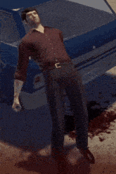 a man laying on the ground next to a car with a license plate that says wch 218