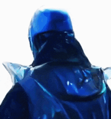 the back of a person wearing a blue helmet and a blue jacket .